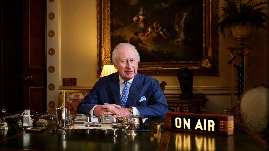 Britain's King Charles poses in his office where "The King's Music Room" recording takes place in Buckingham Palace, London, in this undated handout photo from Apple Music.