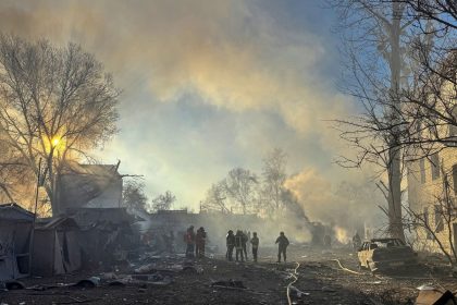 Rescuers respond to a Russian missile strike in Ukraine's Kharkiv region on Friday.