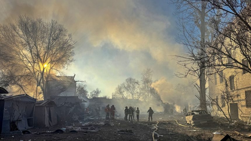 Rescuers respond to a Russian missile strike in Ukraine's Kharkiv region on Friday.