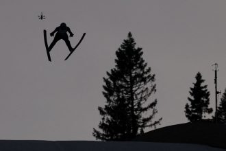 Marius Lindvik is seen competing in the men's large hill competition on Saturday.