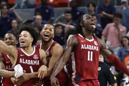 Alabama Crimson Tide guard Mark Sears celebrates after making the game winning shot to beat the Auburn Tigers in overtime.