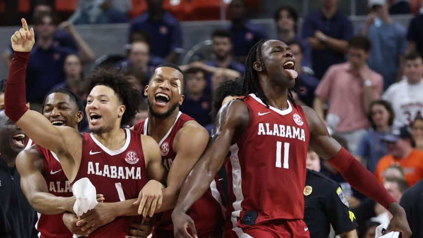 Alabama Crimson Tide guard Mark Sears celebrates after making the game winning shot to beat the Auburn Tigers in overtime.