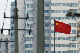 A Chinese national flag flutters in Beijing, China, this month.