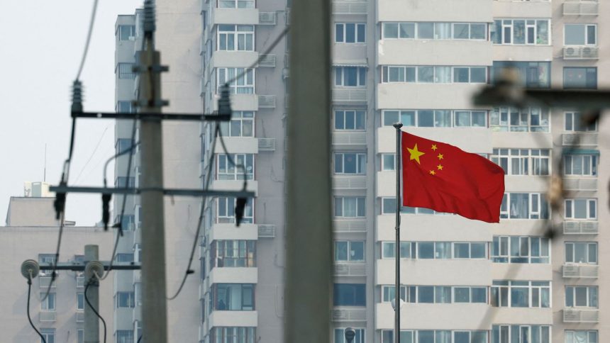 A Chinese national flag flutters in Beijing, China, this month.