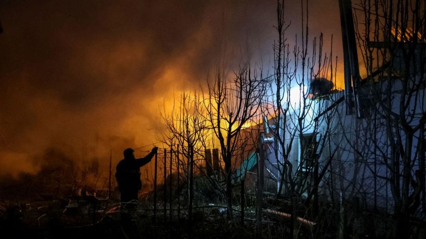 Rescuers respond to a Russian air strike in Ukraine's Kherson region on Friday.