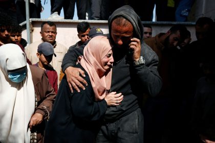 Mourners react next to the bodies of Palestinians killed in an Israeli strike in the northern Gaza Strip on March 15.