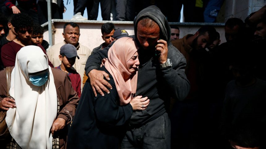 Mourners react next to the bodies of Palestinians killed in an Israeli strike in the northern Gaza Strip on March 15.