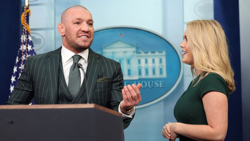 Irish MMA fighter Conor McGregor speaks at the briefing room lectern, with White House press secretary Karoline Leavitt at his side, during a visit to the White House on March 17, 2025.