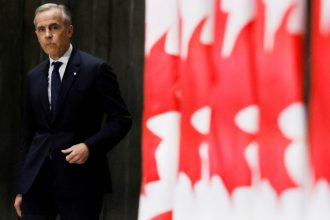 Canada's Prime Minister Mark Carney arrives to a press conference after meeting with provincial and territorial leaders at the Canadian War Museum in Ottawa, Ontario, Canada March 21, 2025.