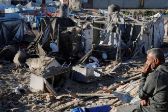 A Palestinian man looks at the scene where an Israeli strike killed Hamas political leader Salah al-Bardaweel and his wife, in Khan Younis in the southern Gaza Strip, on Sunday.