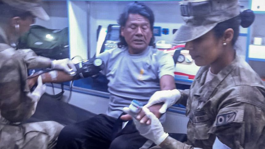 This handout picture released on March 15, 2025, by the Peruvian Navy shows Maximo Napa receiving medical attention upon his arrival in Paita, Peru.