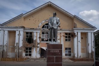 A damaged monument to Vladimir Lenin stands in a central square in Sudzha, Kursk region, in August 2024.