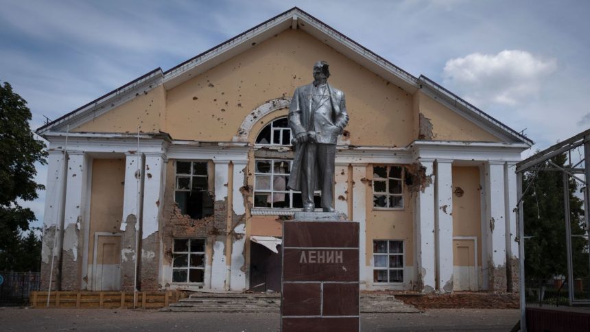 A damaged monument to Vladimir Lenin stands in a central square in Sudzha, Kursk region, in August 2024.