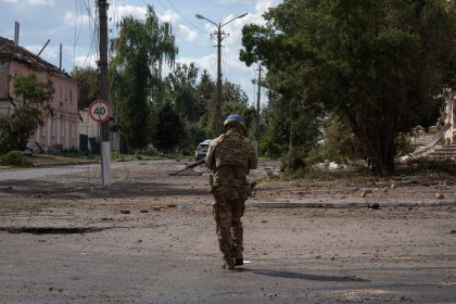 A Ukrainian soldier walks past Sudzha's city center in Kursk region, Russia, on August 16.