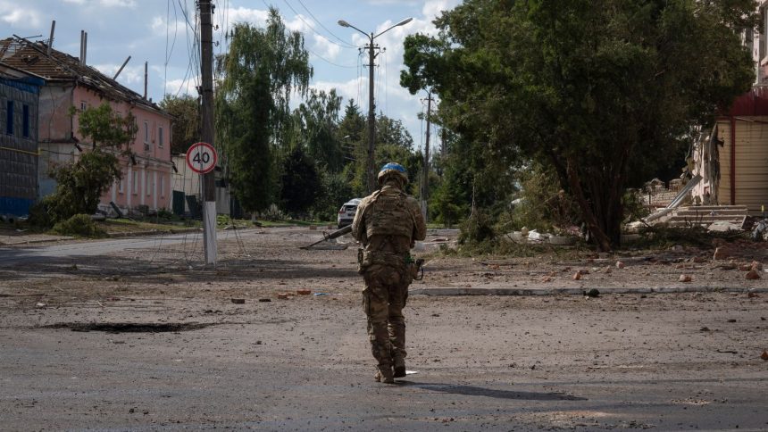 A Ukrainian soldier walks past Sudzha's city center in Kursk region, Russia, on August 16.