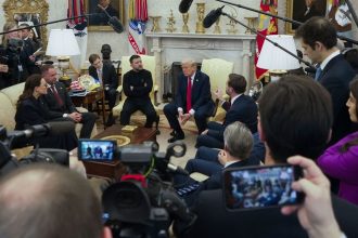 Vice President JD Vance, speaks with Ukrainian President Volodymyr Zelensky as President Donald Trump, listens in the Oval Office at the White House, on February 28, 2025, in Washington.