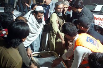 Rescue workers and volunteers help victims of a bomb explosion in Bannu, northwest Pakistan on March 4, 2025.