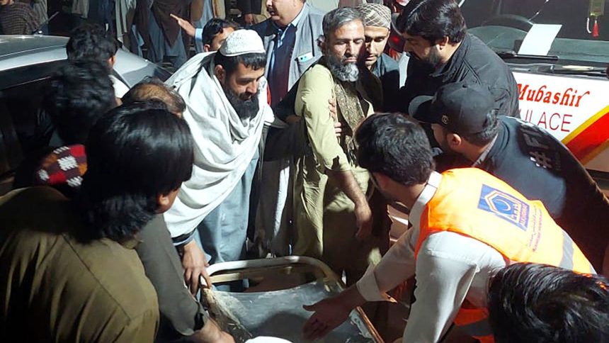 Rescue workers and volunteers help victims of a bomb explosion in Bannu, northwest Pakistan on March 4, 2025.