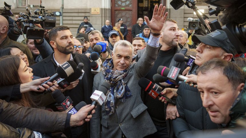 Calin Georgescu waves to supporters after leaving a court in Bucharest, Romania, March 5, 2025.