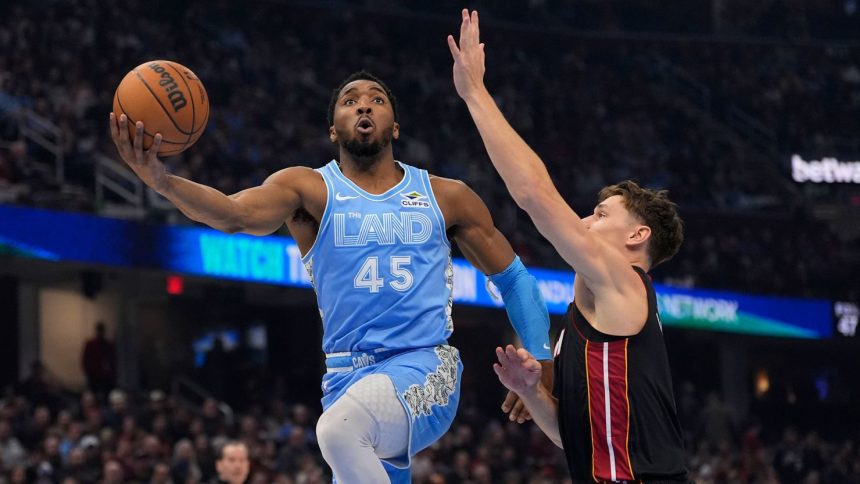 Cleveland Cavaliers guard Donovan Mitchell goes to the basket against the Miami Heat on Wednesday.