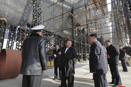 North Korean leader Kim Jong Un, bottom right, visits a shipyard that builds warships at an undisclosed location, in a photo provided by the North Korean government on March 8, 2025.