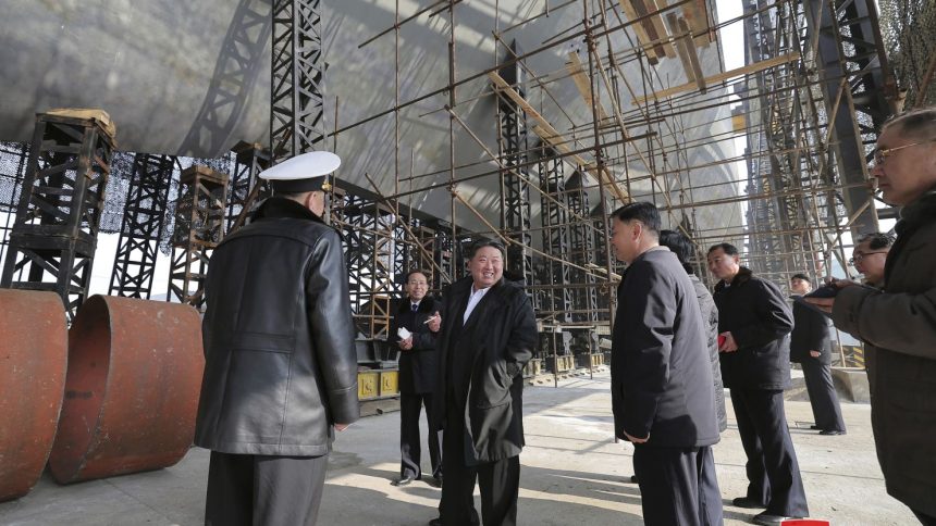 North Korean leader Kim Jong Un, bottom right, visits a shipyard that builds warships at an undisclosed location, in a photo provided by the North Korean government on March 8, 2025.