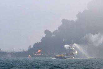 A firefighting ship tries to extinguish the blaze after Monday's collision in the North Sea.