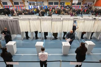 Voters lining up to cast their ballots in parliamentary elections in Nuuk, Greenland, on March 11, 2025.