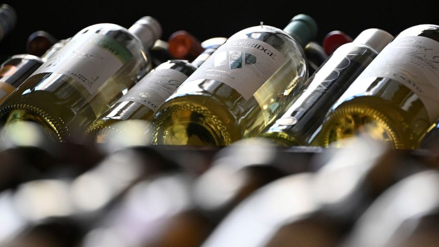 Bottles of wine are displayed at a liquor store in New York City on March 13.