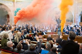 MPs of Momentum protest during the plenary session of the Hungarian parliament in Budapest, Hungary, on March 18.