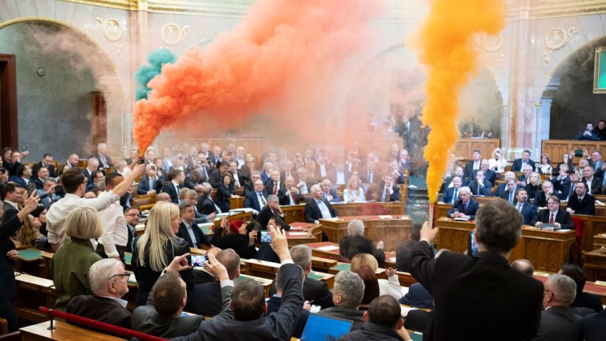 MPs of Momentum protest during the plenary session of the Hungarian parliament in Budapest, Hungary, on March 18.