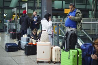 Stranded passengers at Heathrow Terminal 5 in London on Friday.