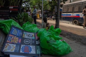 Posters are scattered outside the studio where Indian comedian Kunal Kamra performed in Mumbai, India, Monday, March 24, 2025.