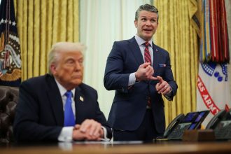 Defense Secretary Pete Hegseth speaks next to President Donald Trump in the Oval Office at the White House in Washington, DC, on Friday, March 21.