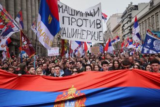 Protesters march during a major rally against populist President Aleksandar Vucic and his government in downtown Belgrade, Serbia, on March 15.