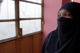 Omnia and her children have sought refuge in a new city after being displaced from their home due to the fighting and threats from armed men.