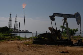 A Petroleos de Venezuela SA (PDVSA) oil pumpjack on Lake Maracaibo in Cabimas, Zulia state, Venezuela.