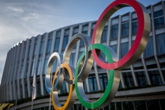 The Olympic rings are seen outside the headquarters of the International Olympic Committee (IOC) at the opening day of a executive board meeting in Lausanne on March 19, 2024. (Photo by Fabrice COFFRINI / AFP)