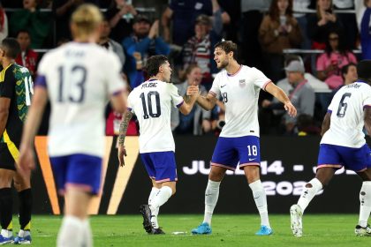 Christian Pulisic (No. 10) and Tanner Tessmann (No. 18) of the United States celebrate a goal during a November Concacaf Nations League quarterfinal match against Jamaica.