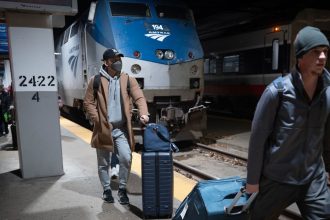 Passengers arrive on an Amtrak train at Union Station in Chicago on December 4, 2024.