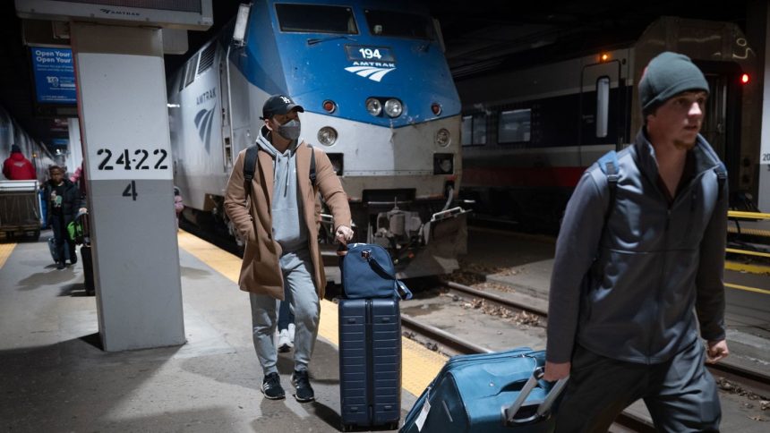 Passengers arrive on an Amtrak train at Union Station in Chicago on December 4, 2024.