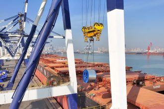 Export steel coils are lifted onto a ship at Yantai Port in Yantai, China, on February 14, 2025.