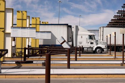 Tractor trailers carrying products from Mexico in the primary cargo inspection lane at the Nogales-Mariposa port of entry on the US-Mexico border. President Donald Trump has imposed a 25% tariff on Mexican imports.