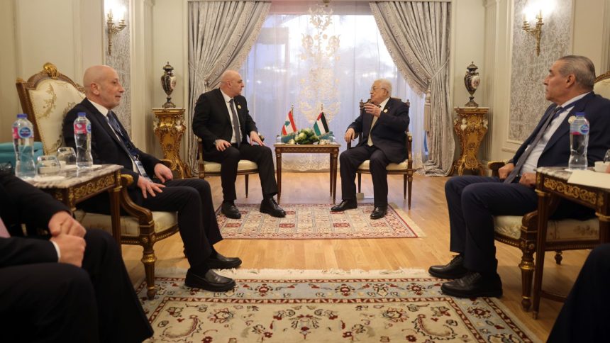 Palestinian President Mahmoud Abbas, center right, meets with Lebanese President Joseph Aoun, center left, during an Emergency Arab summit in Cairo, Egypt, on Tuesday.