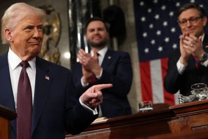 US Vice President JD Vance and Speaker of the House Mike Johnson (R-LA) applaud as US President Donald Trump speaks during an address to a joint session of Congress in the House Chamber of the US Capitol in Washington, DC, on March 4, 2025. (Photo by Win McNamee / POOL / AFP) (Photo by WIN MCNAMEE/POOL/AFP via Getty Images)