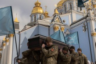 Ukrainian military members carry the coffin of a Ukrainian drone operator who was killed fighting Russian troops at the front, during his funeral ceremony in Kyiv on March 5, 2025.