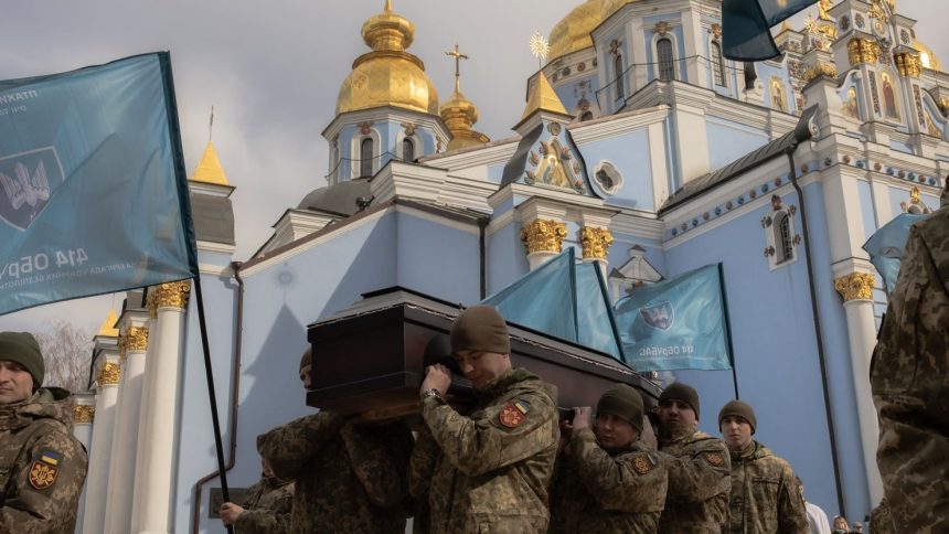 Ukrainian military members carry the coffin of a Ukrainian drone operator who was killed fighting Russian troops at the front, during his funeral ceremony in Kyiv on March 5, 2025.