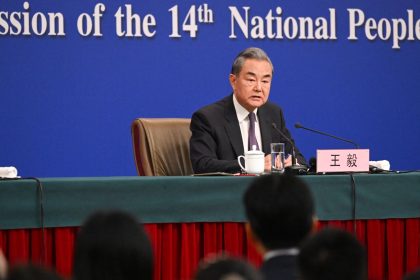 China's Foreign Minister Wang Yi speaks at a press conference during the ongoing National People's Congress (NPC) in Beijing on March 7, 2025.