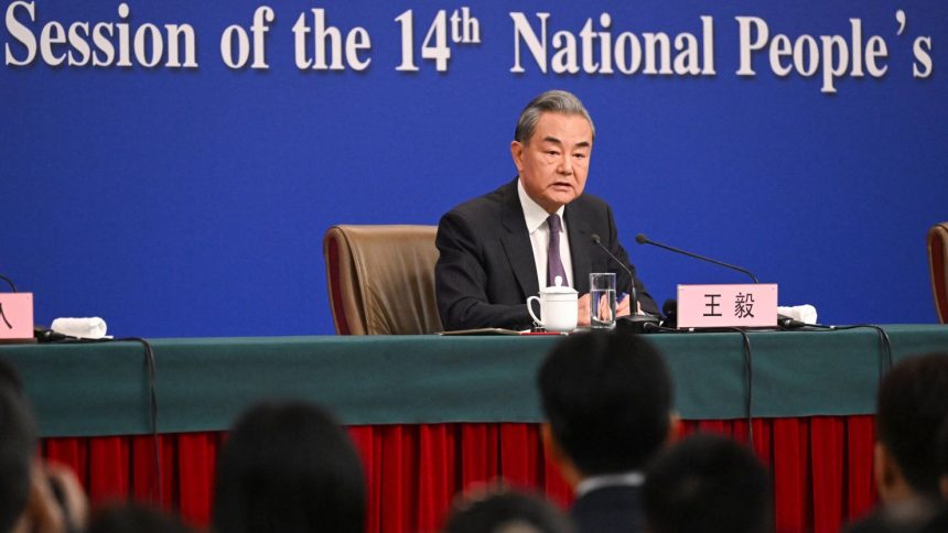 China's Foreign Minister Wang Yi speaks at a press conference during the ongoing National People's Congress (NPC) in Beijing on March 7, 2025.