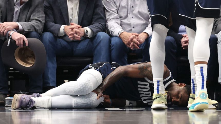 Kyrie Irving lies on the court after suffering an injury against the Sacramento Kings on Monday.